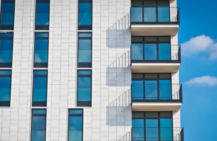 Row of modern townhomes against a clear sky